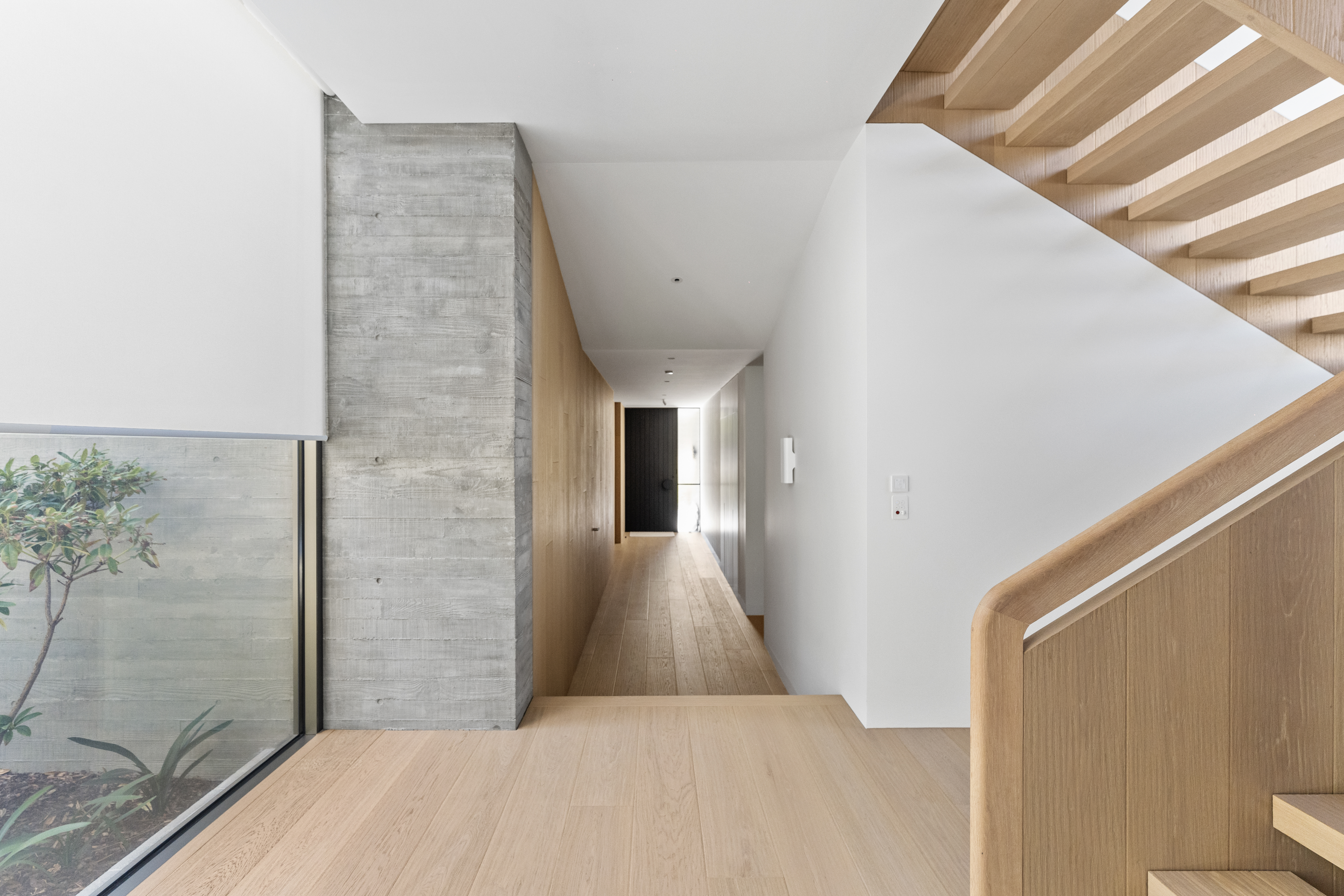 Black Rock — hallway with oak flooring and staircase